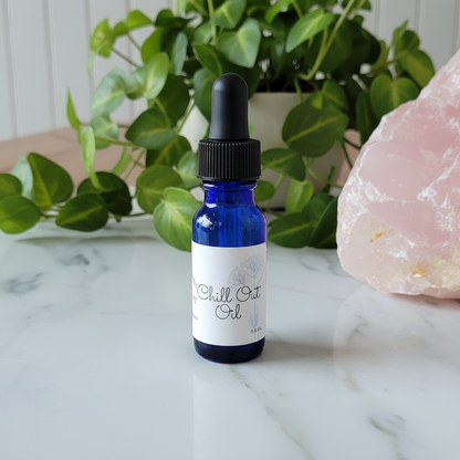 Chill Out Oil 0.5 fl oz glass dropper bottle by Apothecary by SFRAW on a clean marble surface
